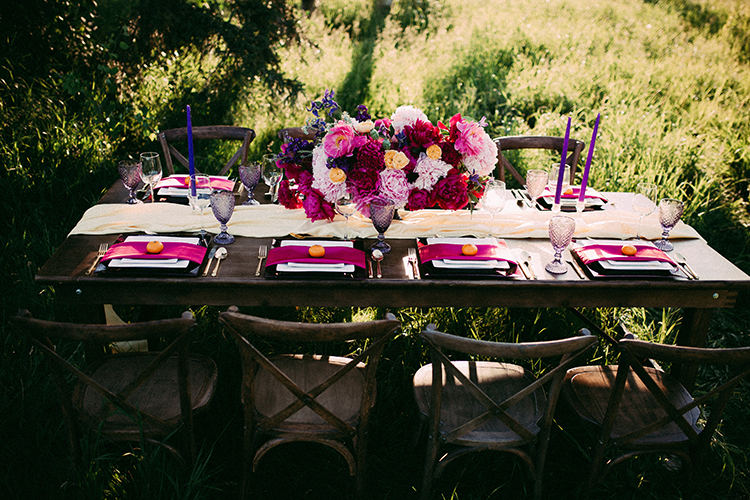 vibrant pink wedding tables - http://ruffledblog.com/vibrant-boho-wedding-inspiration-with-a-bright-green-bus
