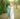 bride and groom kiss in Tuscany while holding the leash to their small puppy