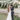 bride and groom kiss at their outdoor wedding reception in Greece