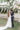 bride and groom kiss at their outdoor wedding reception in Greece