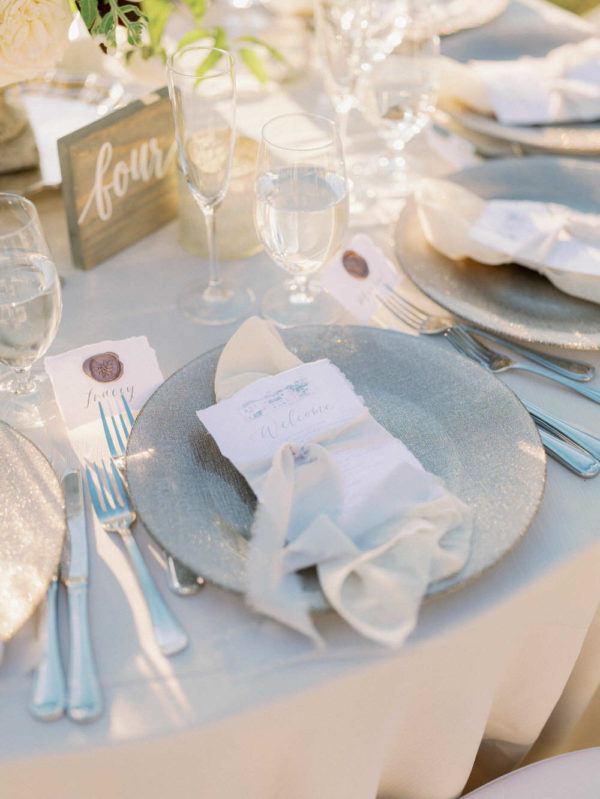 grey plate with watercolor menu at each place setting