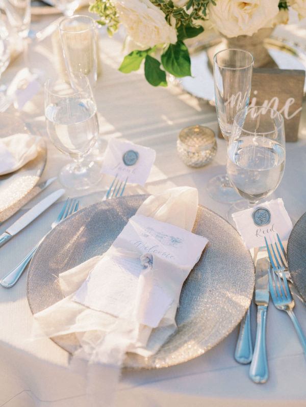 grey plate with watercolor menu at each place setting