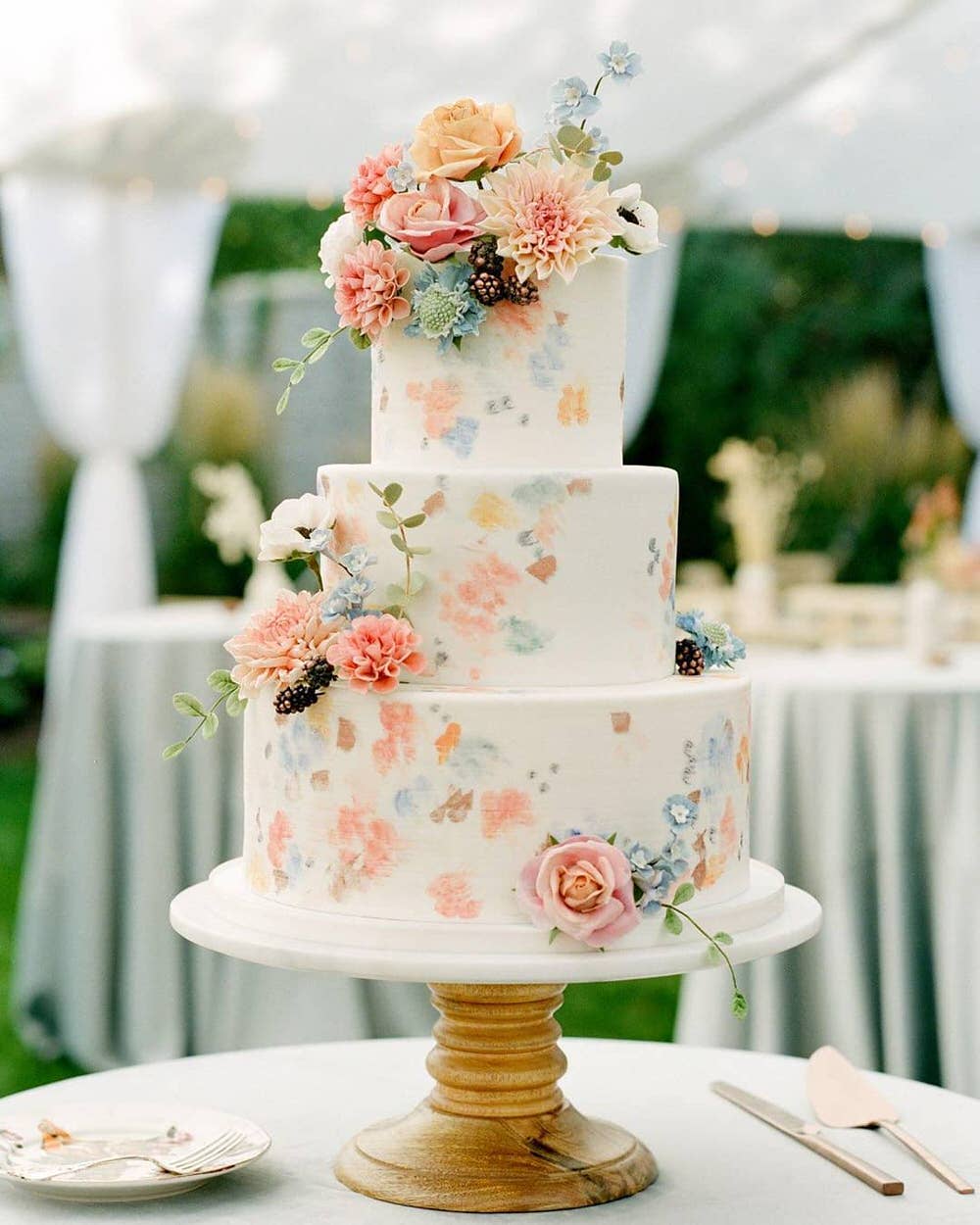 tiered spring wedding cake with fresh florals