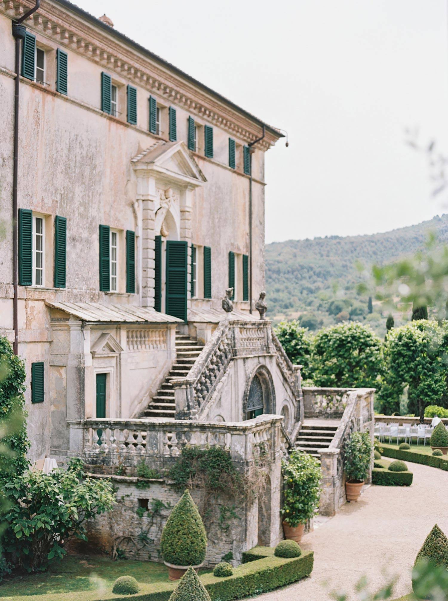 historic Italian villa with manicured garden lawn