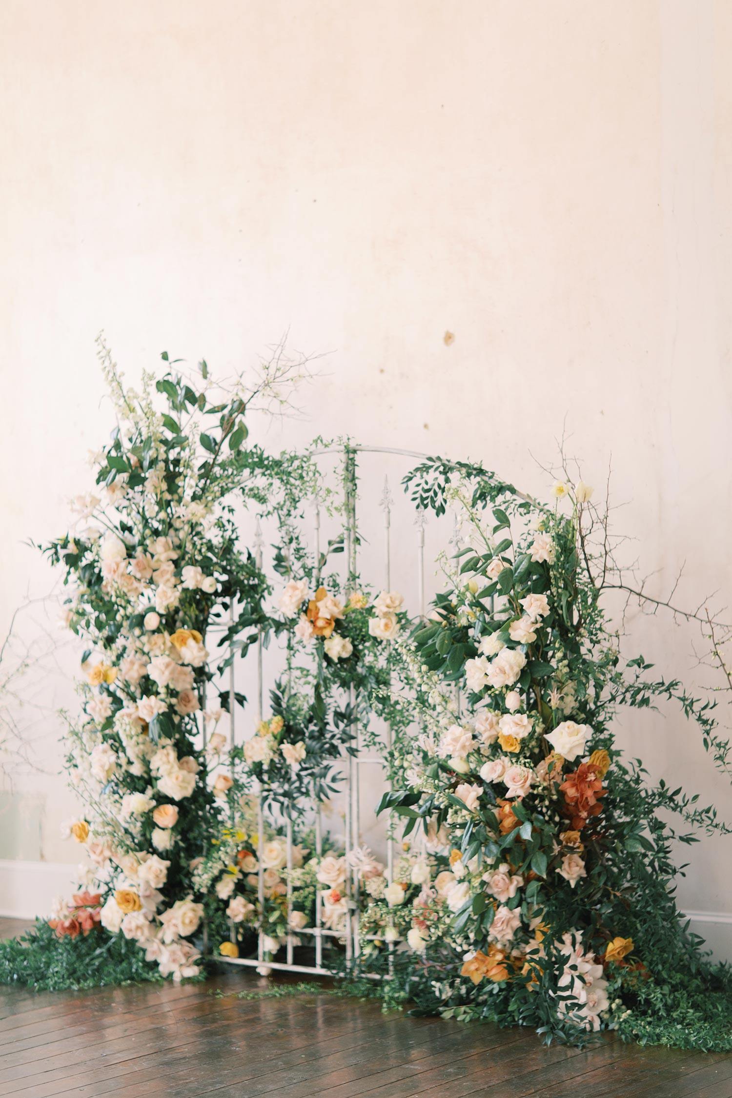 floral iron gate wedding backdrop