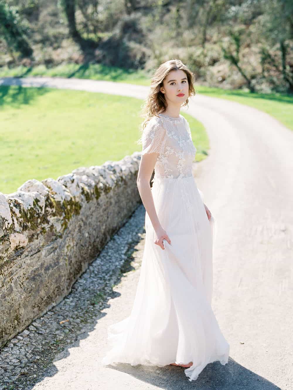 delicate spring bridal gown with seasonally inspired wedding flowers
