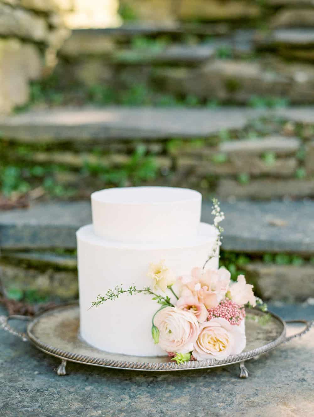 spring buttercream cake with seasonally inspired wedding flowers
