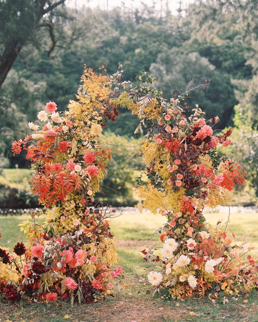 fall wedding backdrop with autumnal foliage