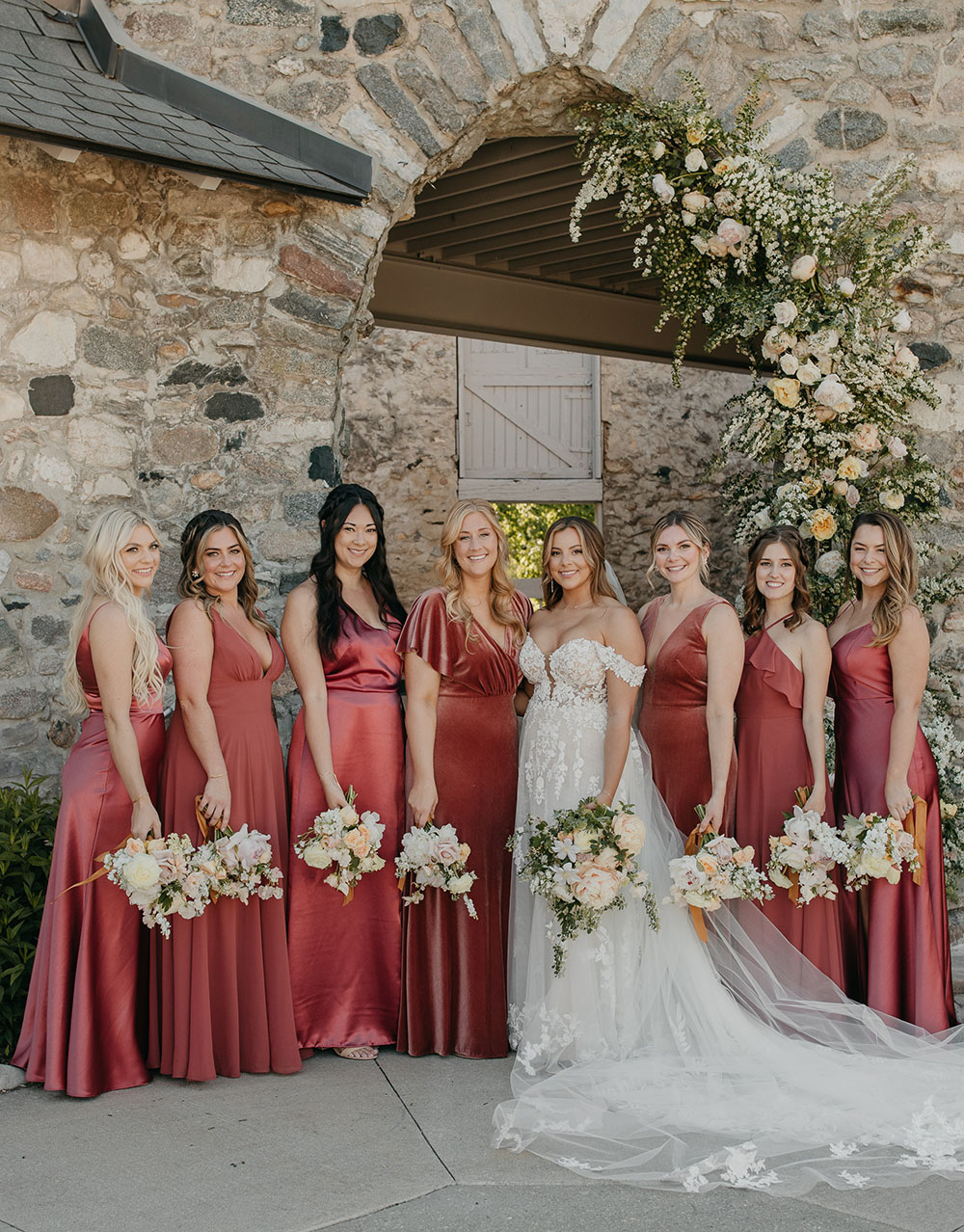 Mismatched bridesmaid dresses from Jenny Yoo in an English Rose color