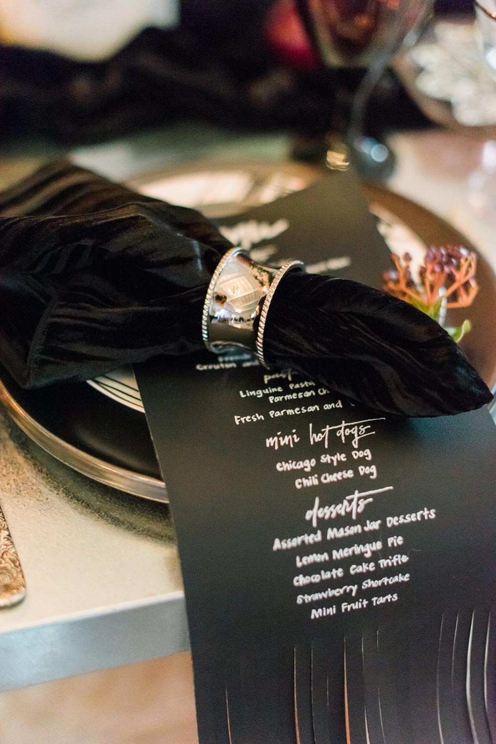 black leather wedding menus and grungy tablescape