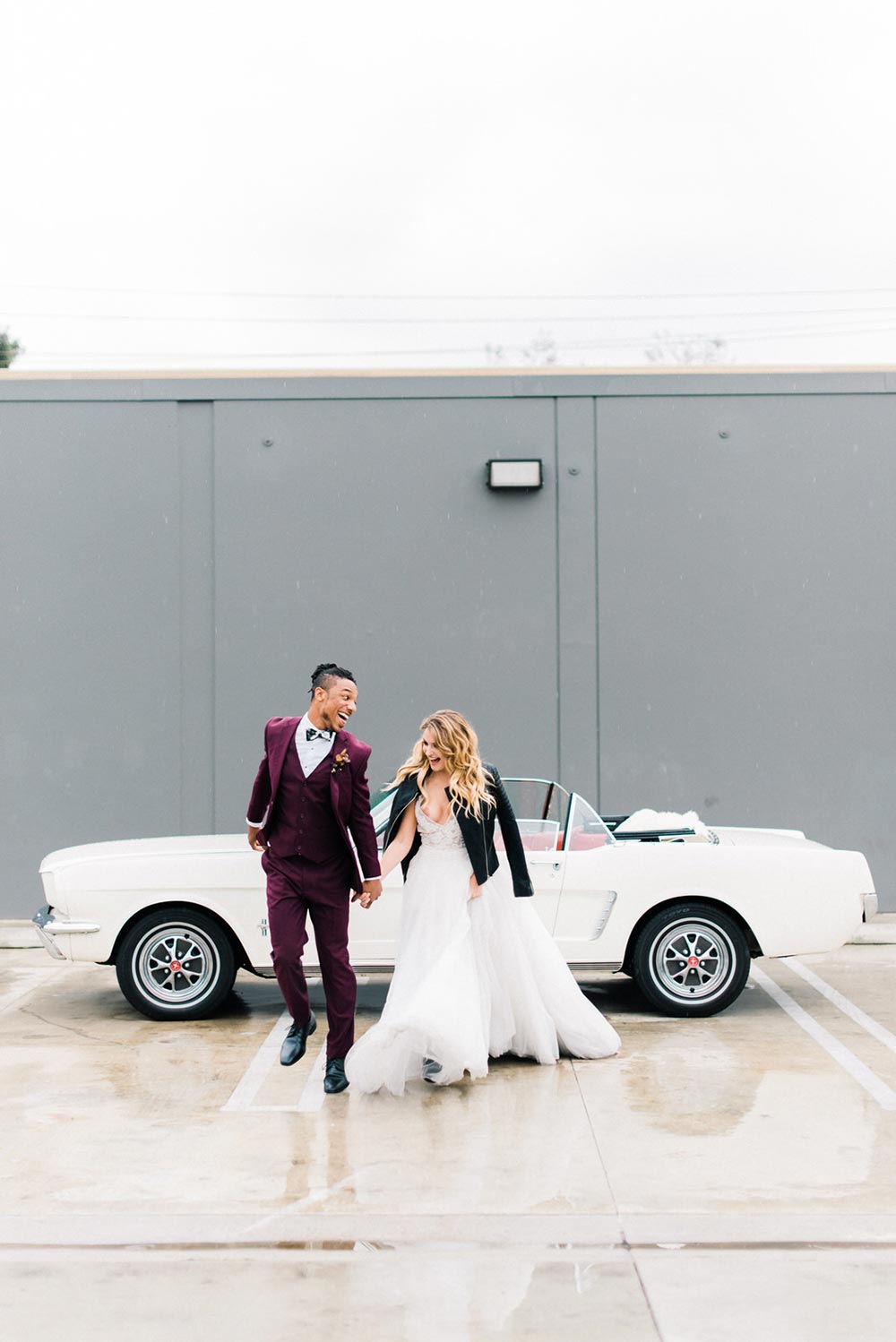 dark red groom suit and black leather bridal jacket with mustang convertible