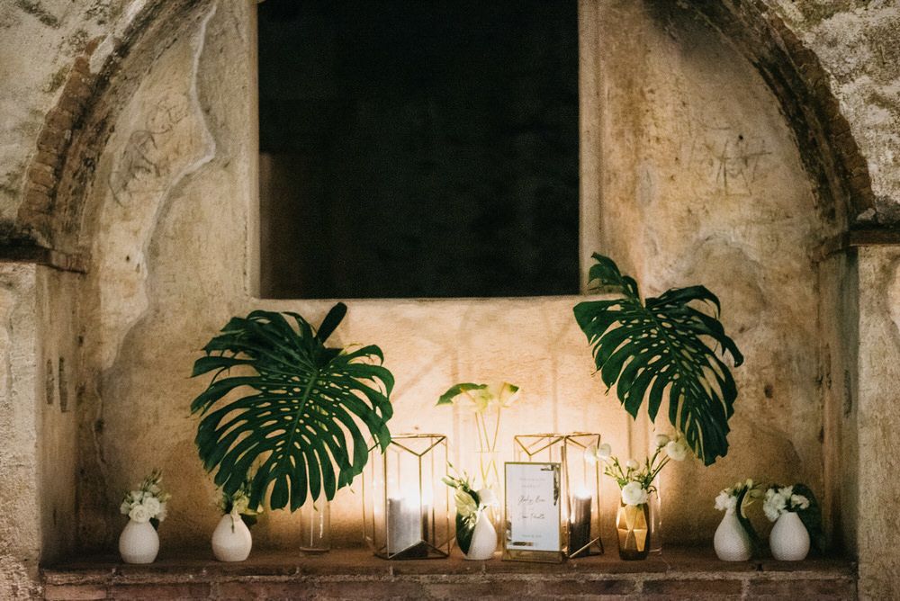 tropical greens and crisp white wedding reception decor