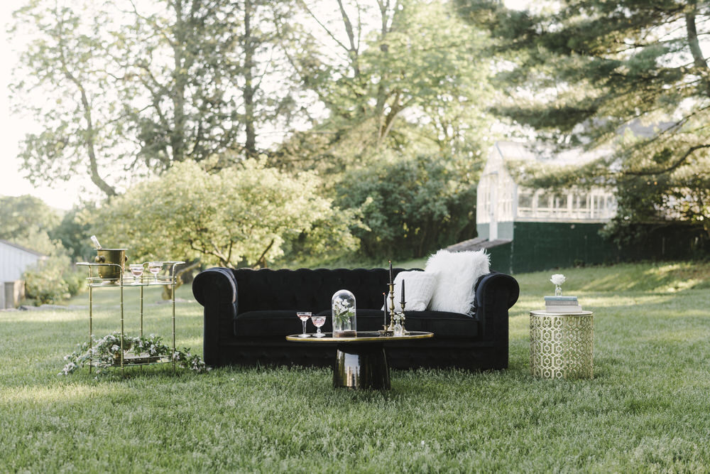velvet couch setup at wedding reception 