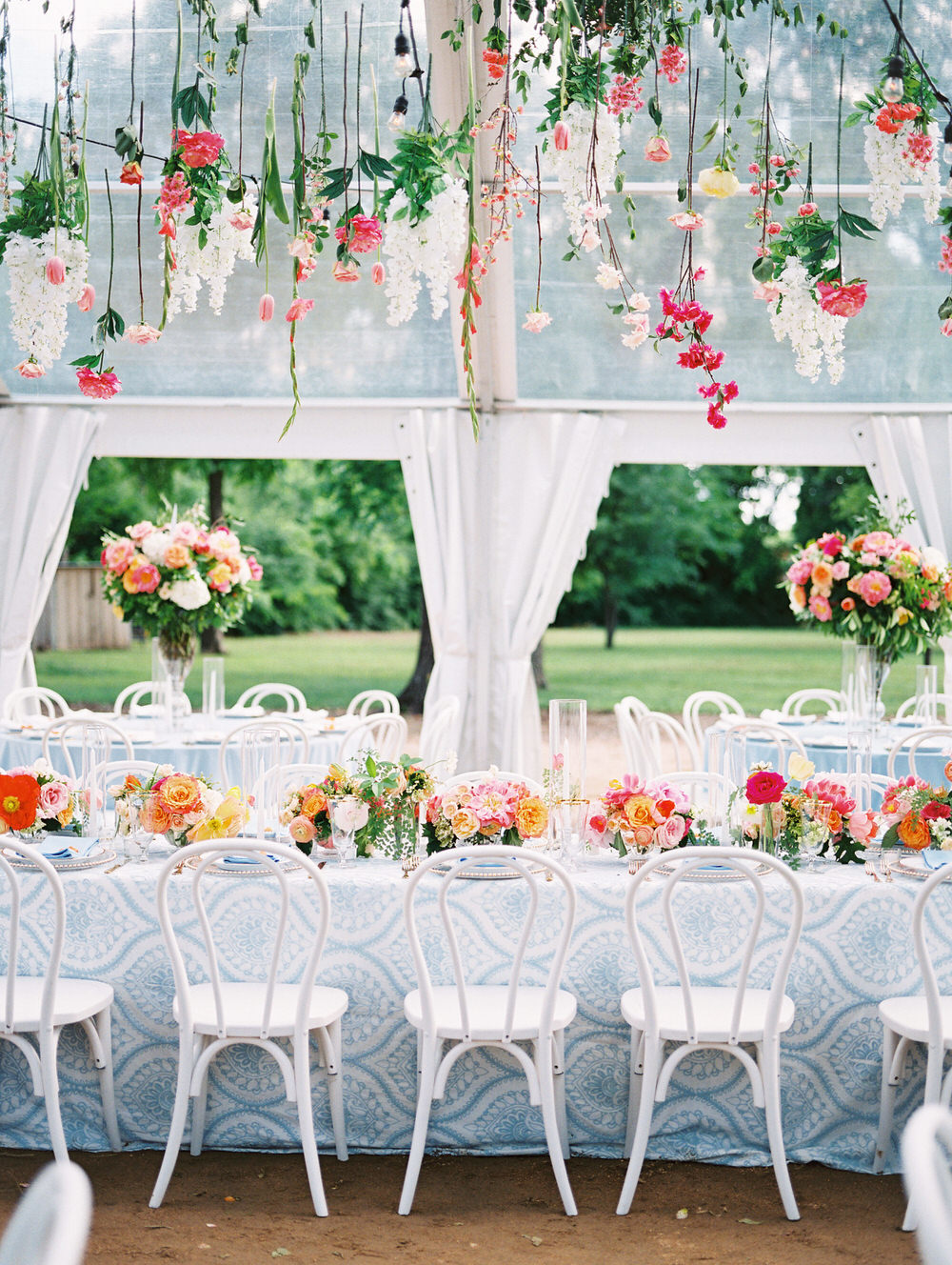 drippy florals hang over the head table at the reception