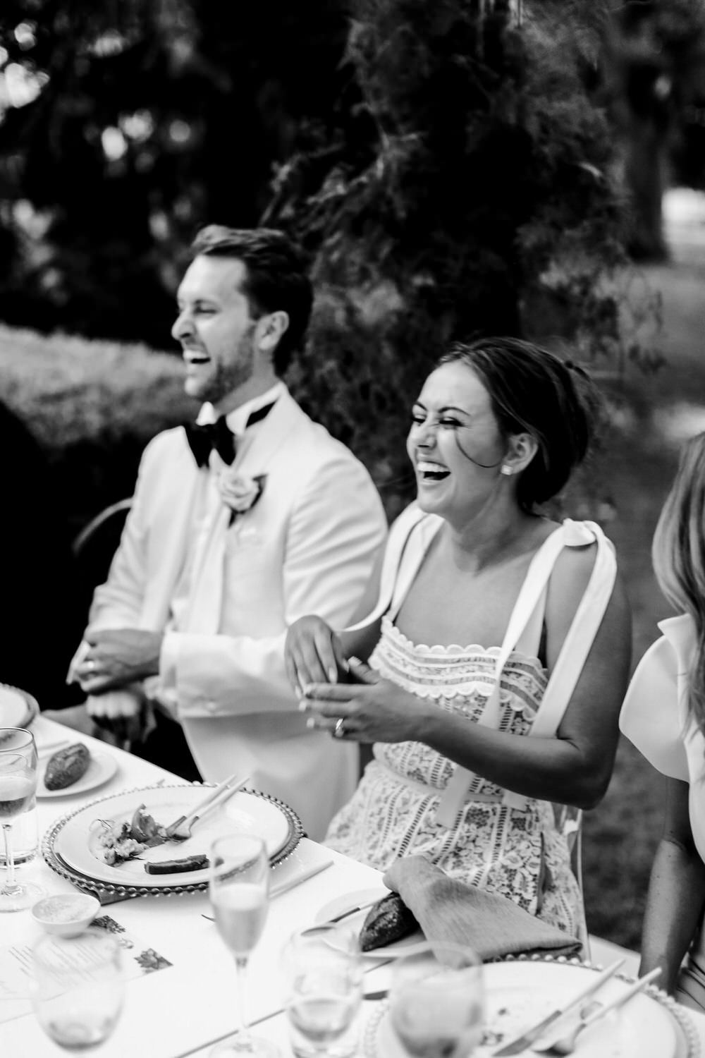bride and groom laughing during the reception