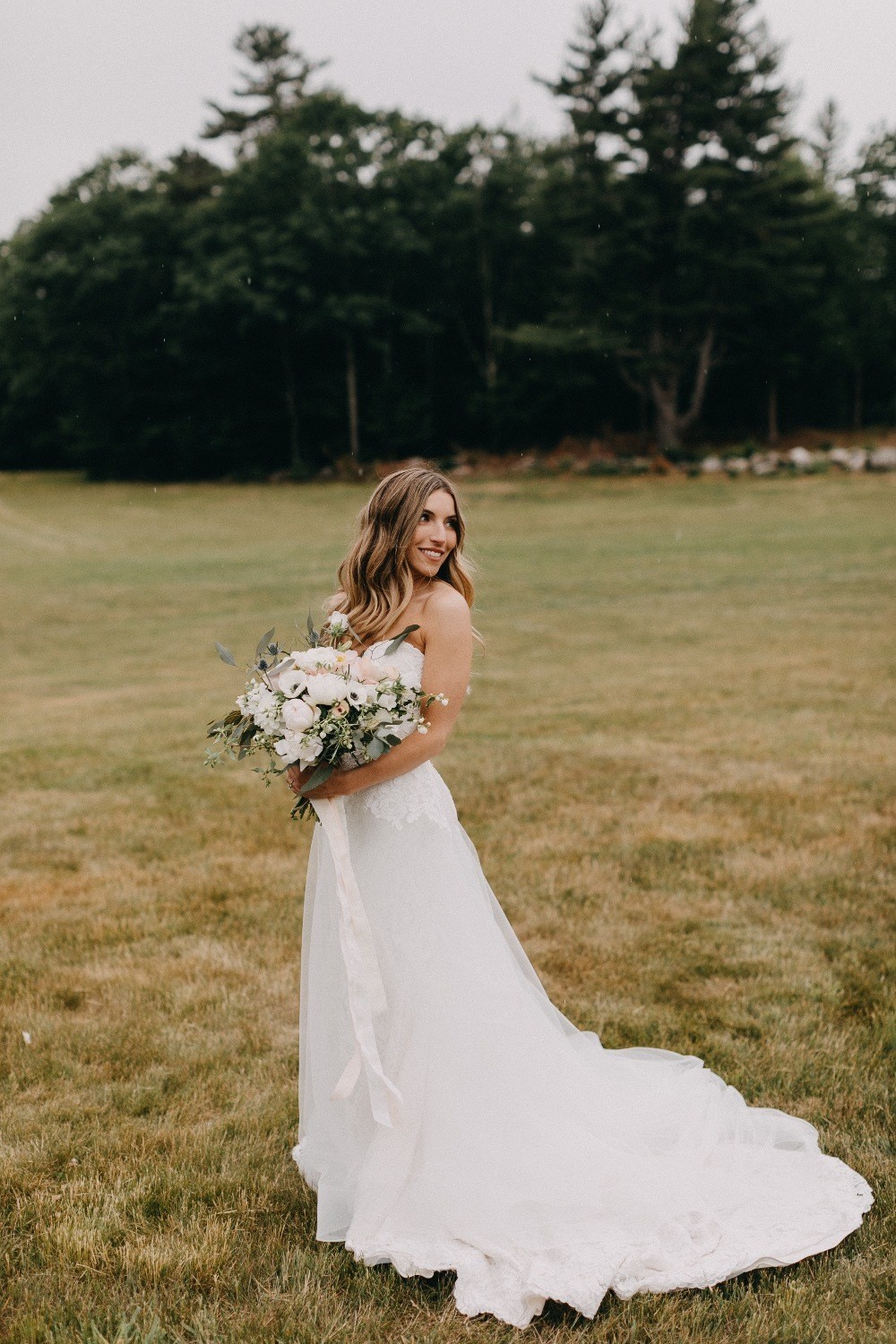 bridal portrait in lush green field