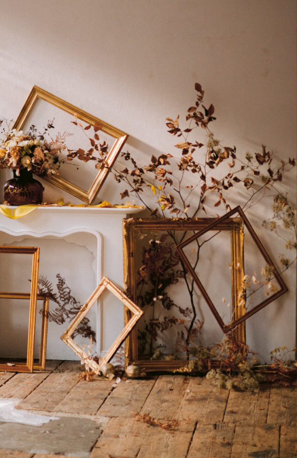 mismatched frames and twisted dried botanical decor