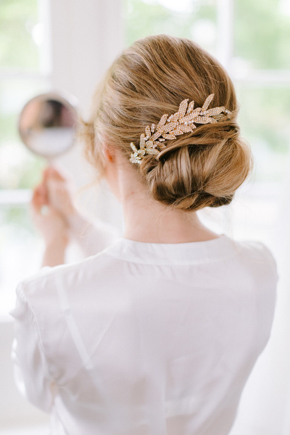 bridal updo with gold hairpiece