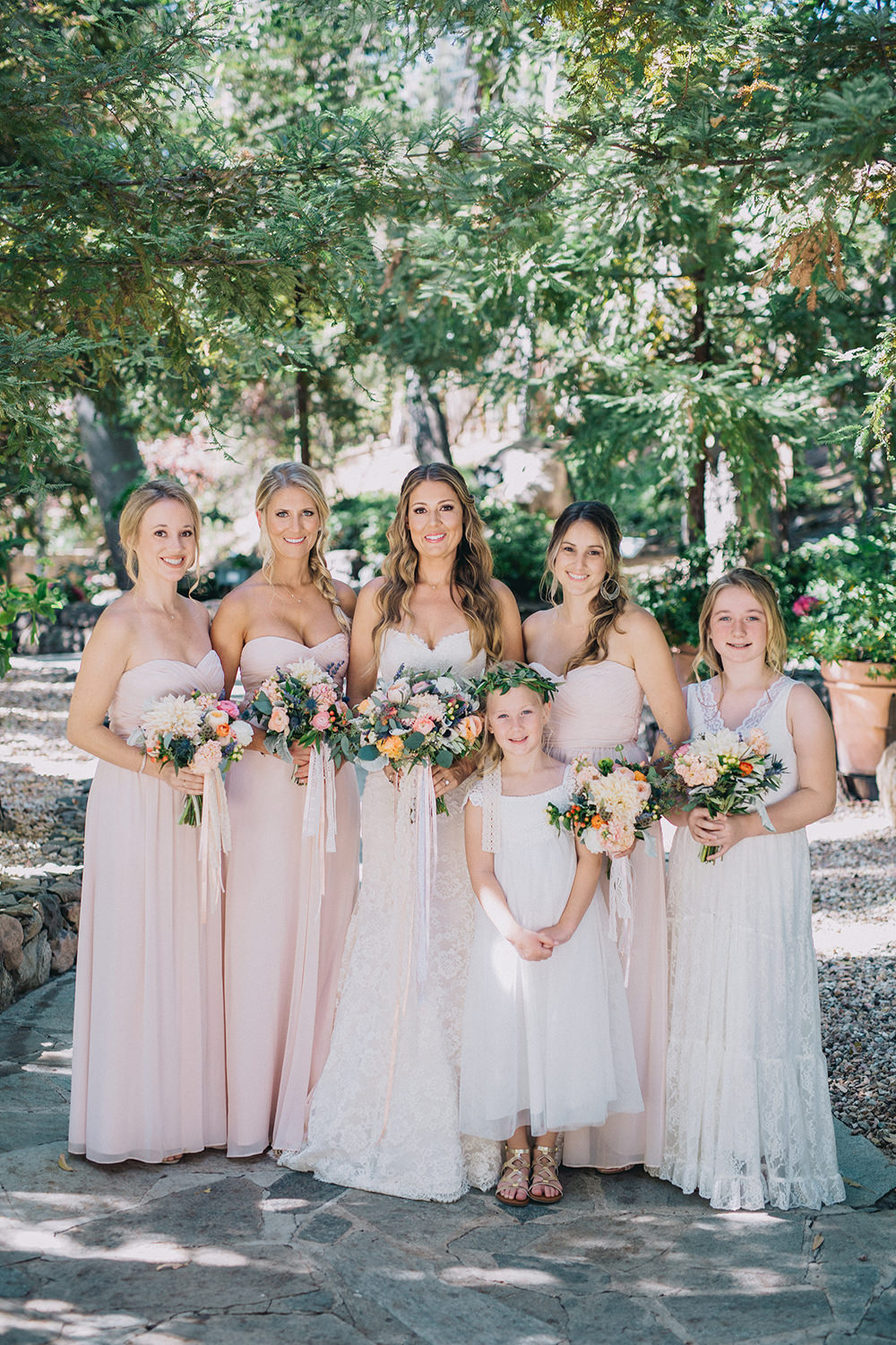 bridesmaids in blush pink dresses - photo by Dave Richards Photography https://ruffledblog.com/boho-calamigos-ranch-wedding