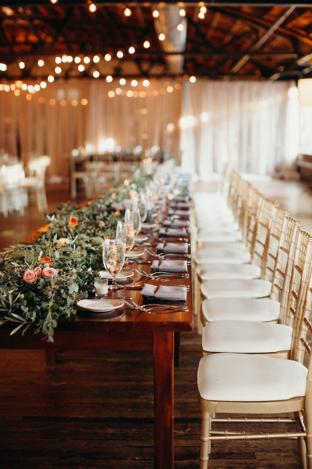 rustic chic wedding reception with greenery garland 