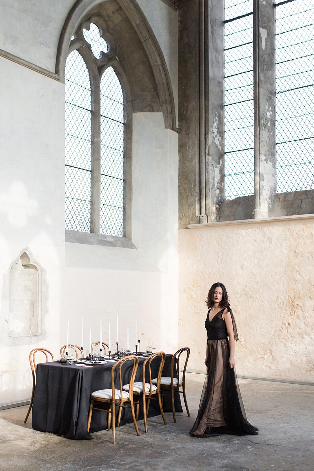 modern black tablescape in classical stonewashed venue