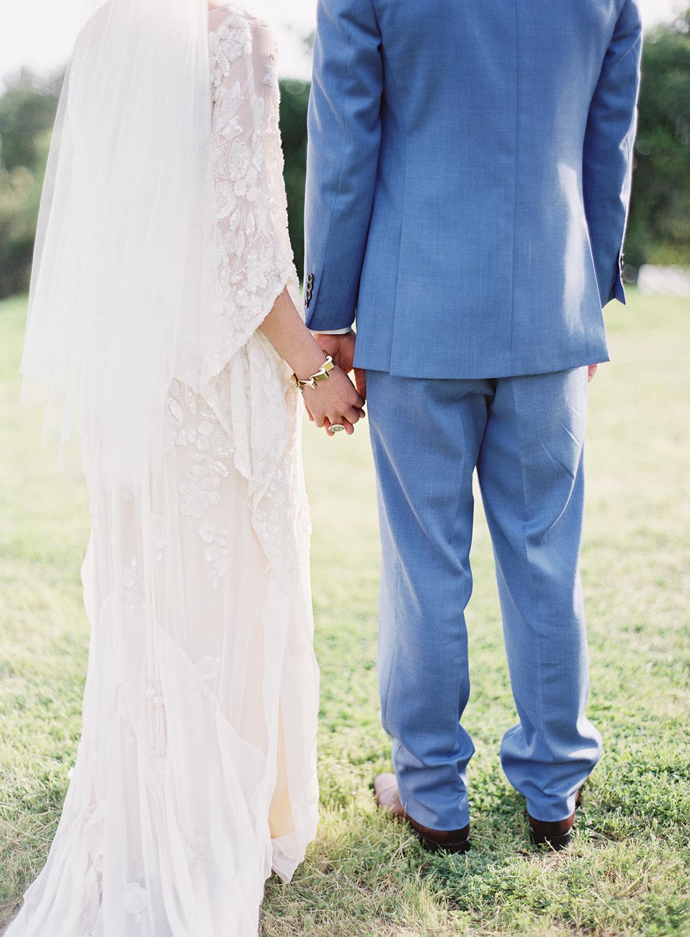 handbeaded caftan wedding dress and blue groom suit