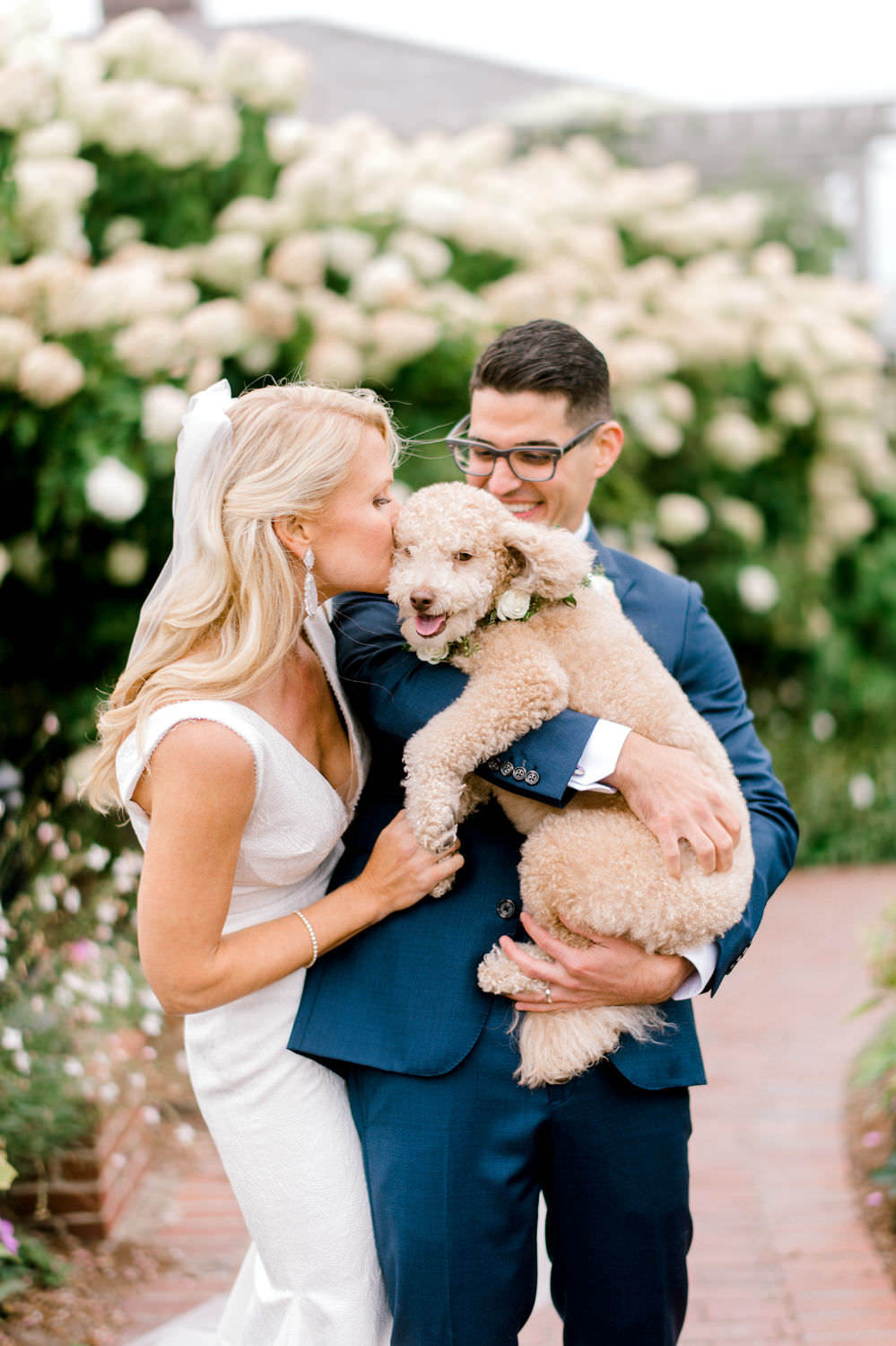 briden and groom with poodle
