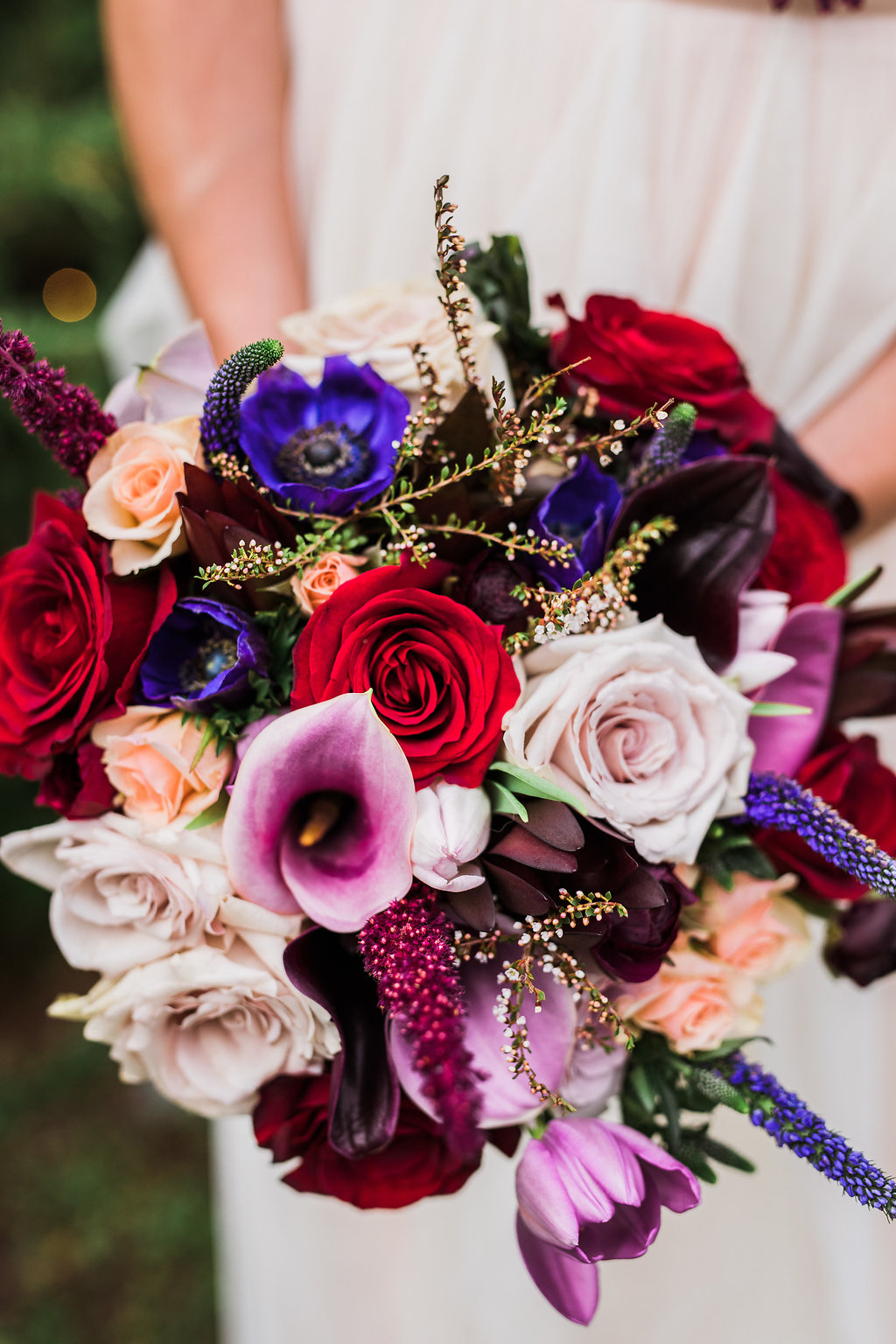 colorful fall wedding bouquets - photo by Katie Ricard Photography https://ruffledblog.com/dramatic-woodland-wedding-inspiration-with-burgundy-accents