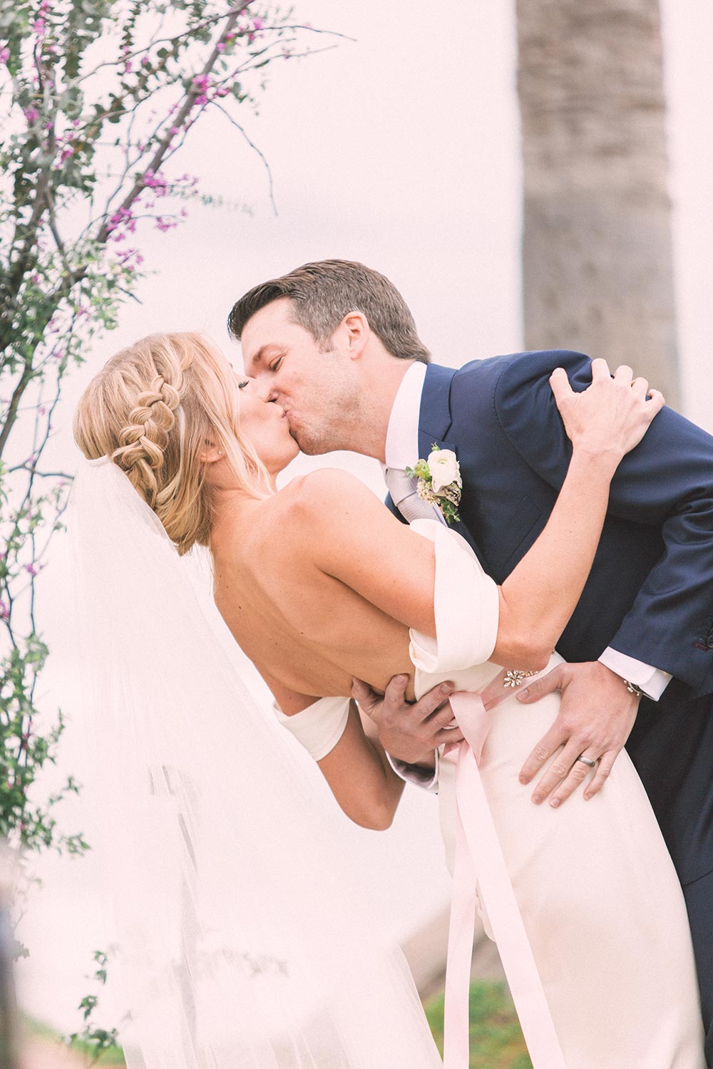 off the shoulder wedding dress with soft pink bow