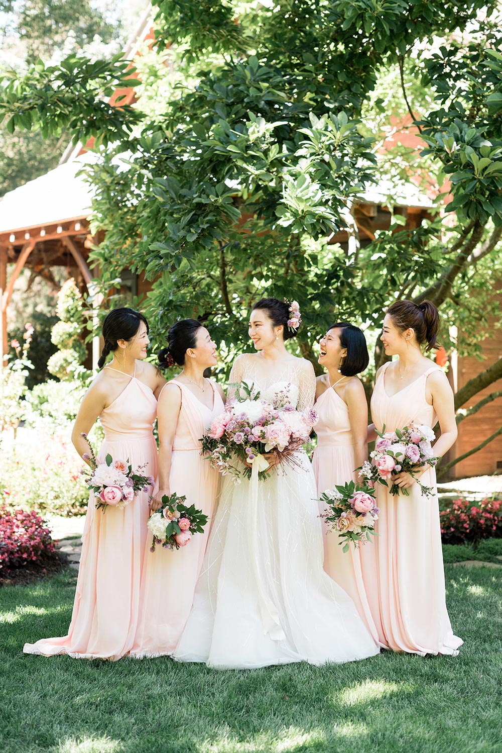 modern and classical longsleeve wedding dress and soft pink bridesmaid dresses