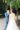 modern and classical longsleeve wedding dress and blue groom suit first look