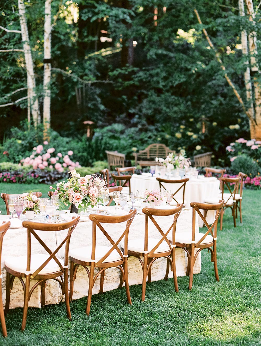 forest wedding cocktail hour with pink tablecloth