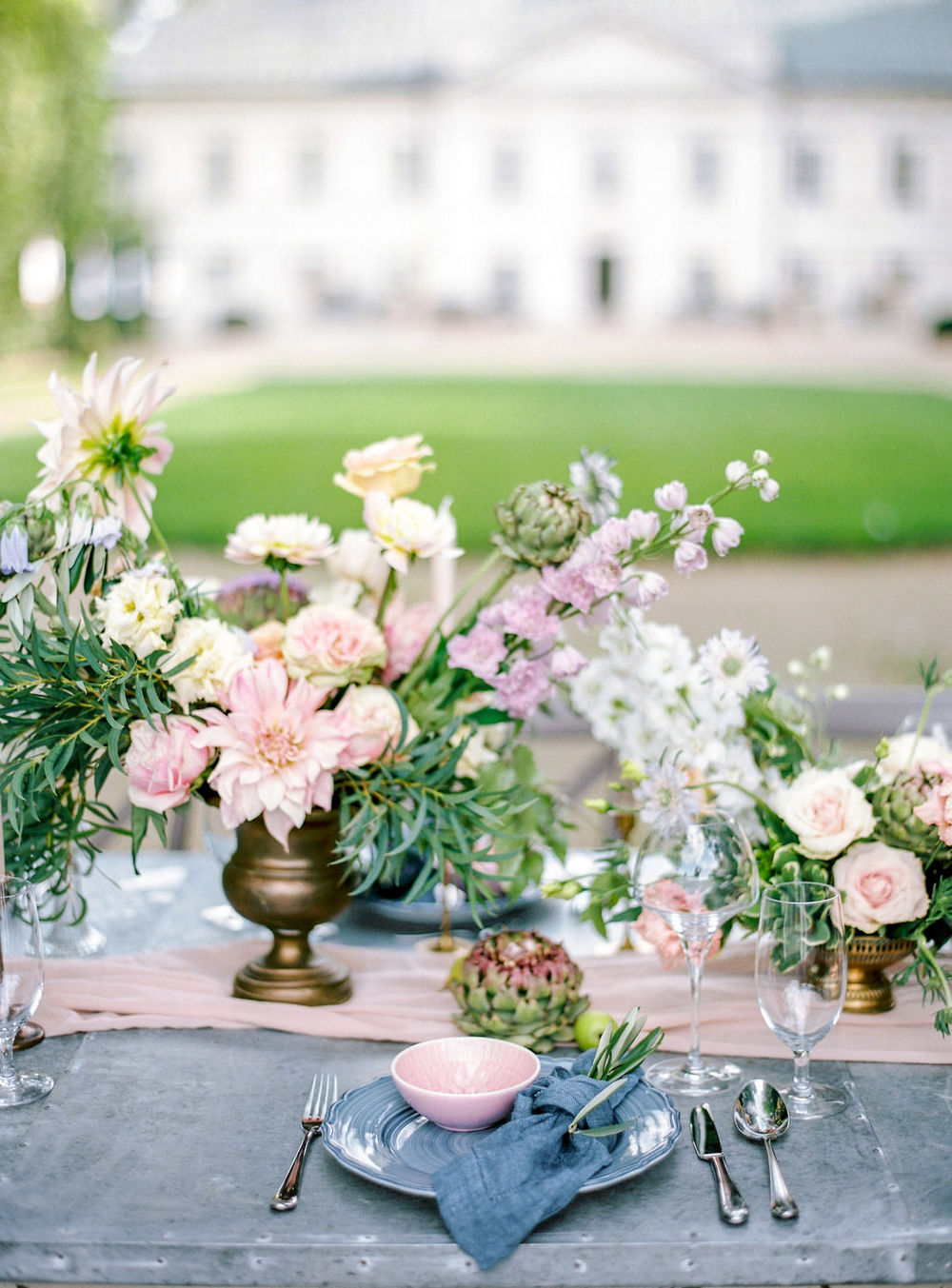 chambray knot napkin with glazed blue and pink plates wedding tablescape