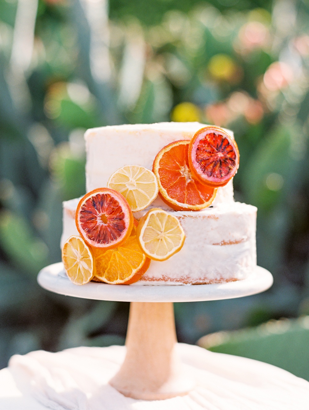 naked wedding cake with citrus