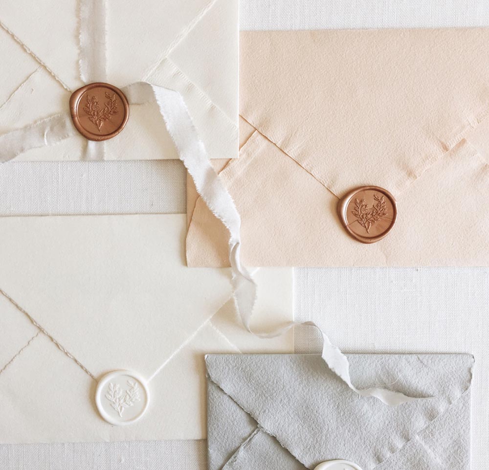 pastel wedding envelopes with wax seals