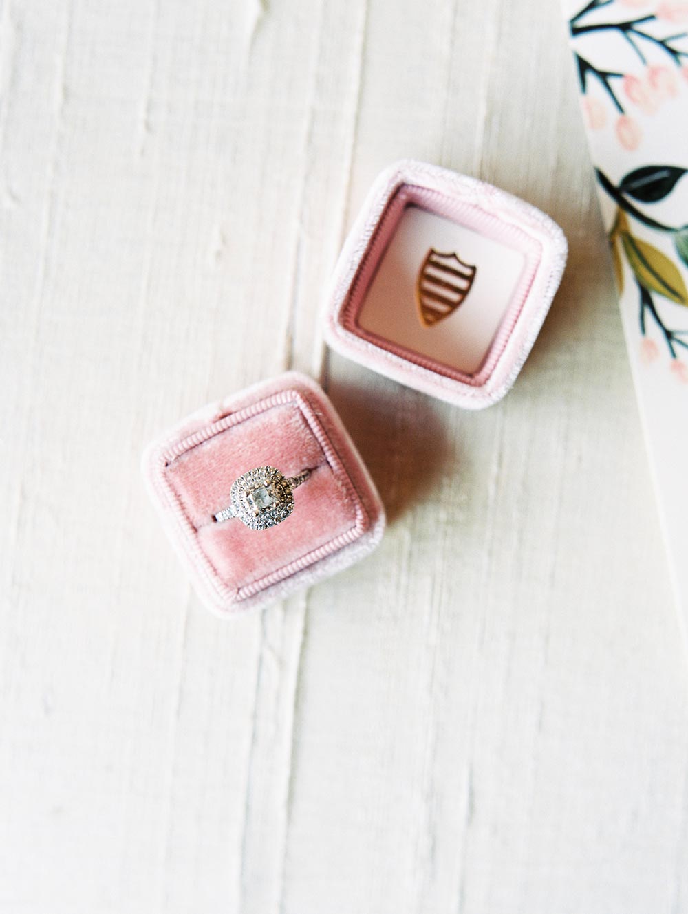 cushion cut engagement ring with diamond halo