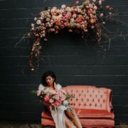 We Cannot Get Over This Edgy Bride’s Dusty Pink Wildflower Backdrop #floralinstallations #weddingceremonybackdrop #edgybridalstyle