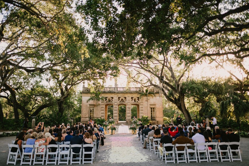 majestic ceremony venue with scattered rose petals on the aisle 