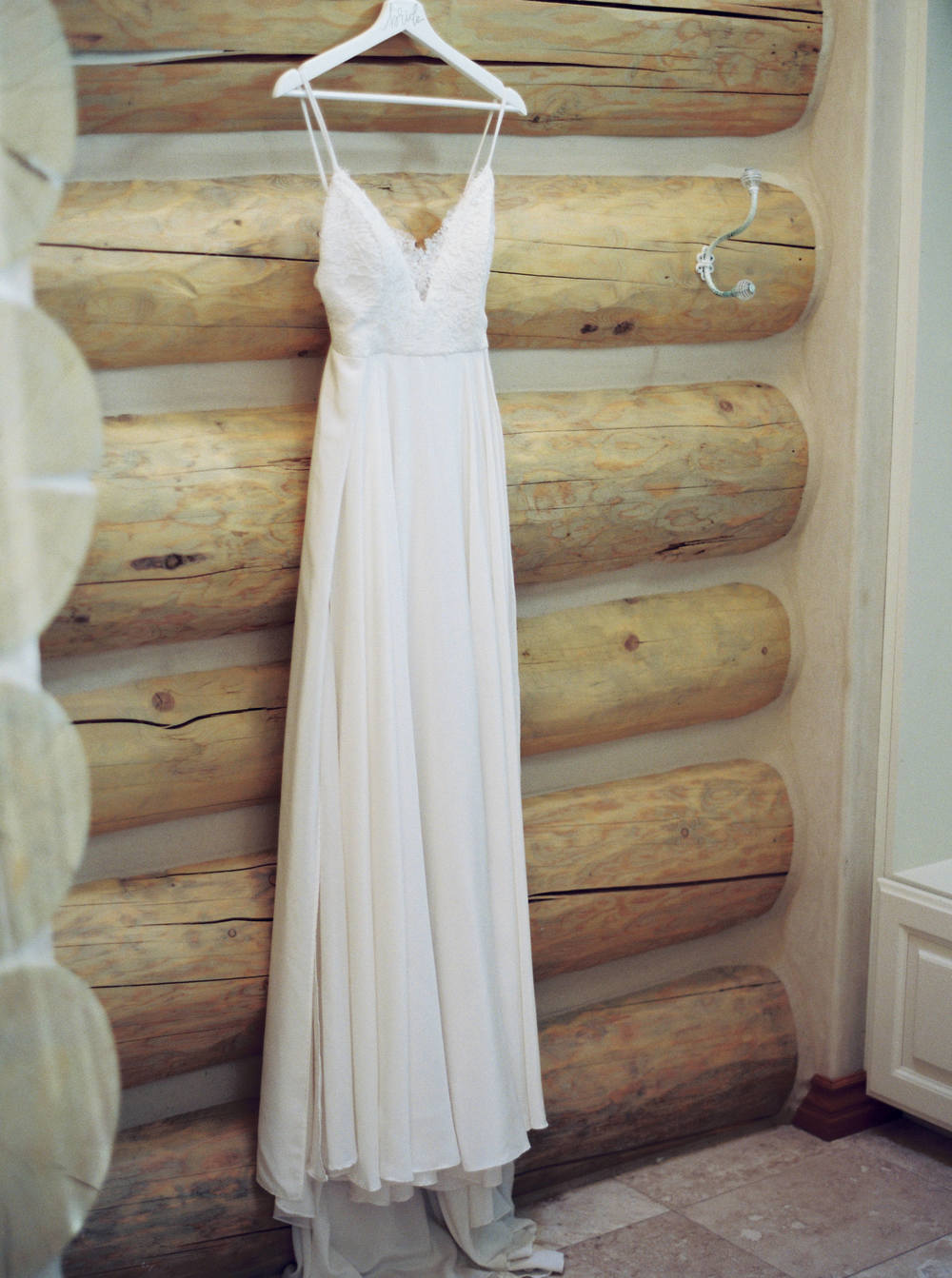 flowy spaghetti strap wedding dress