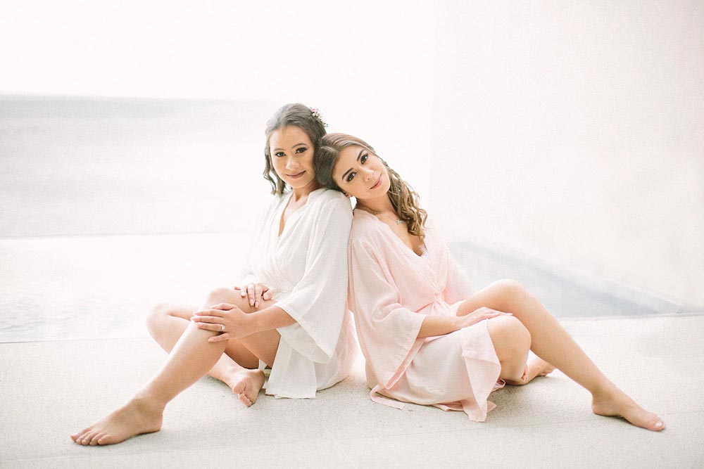 bride and maid of honor in wedding day robes