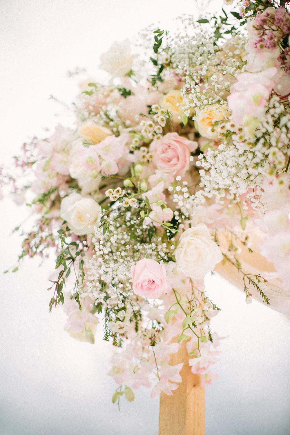 lush pink and cream wedding flowers ceremony decor