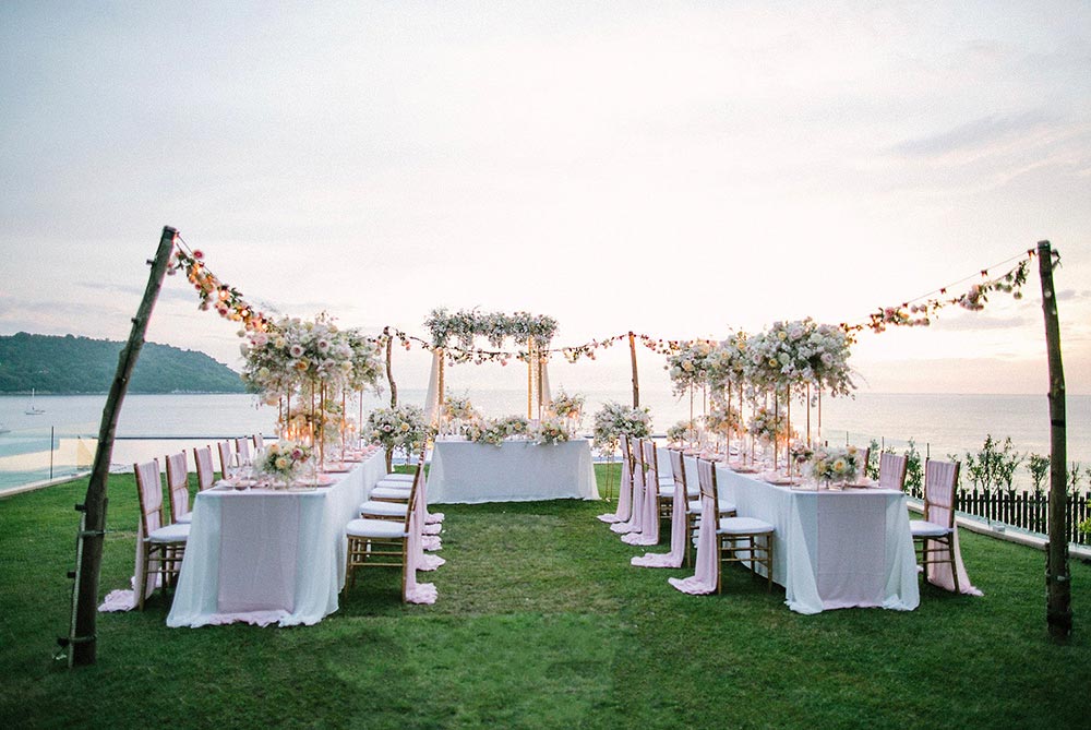 al fresco Thailand wedding reception with string lights