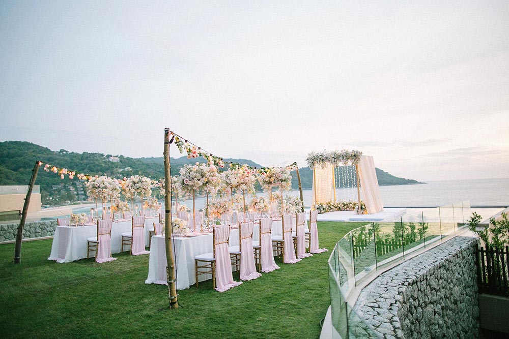 al fresco Thailand wedding reception with string lights