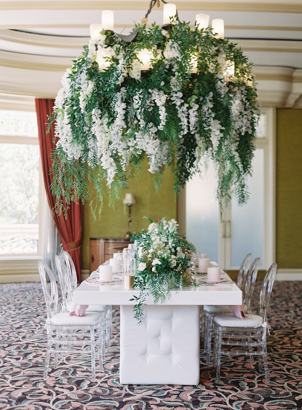bridal shower tablescape with acrylic chairs and pink decor