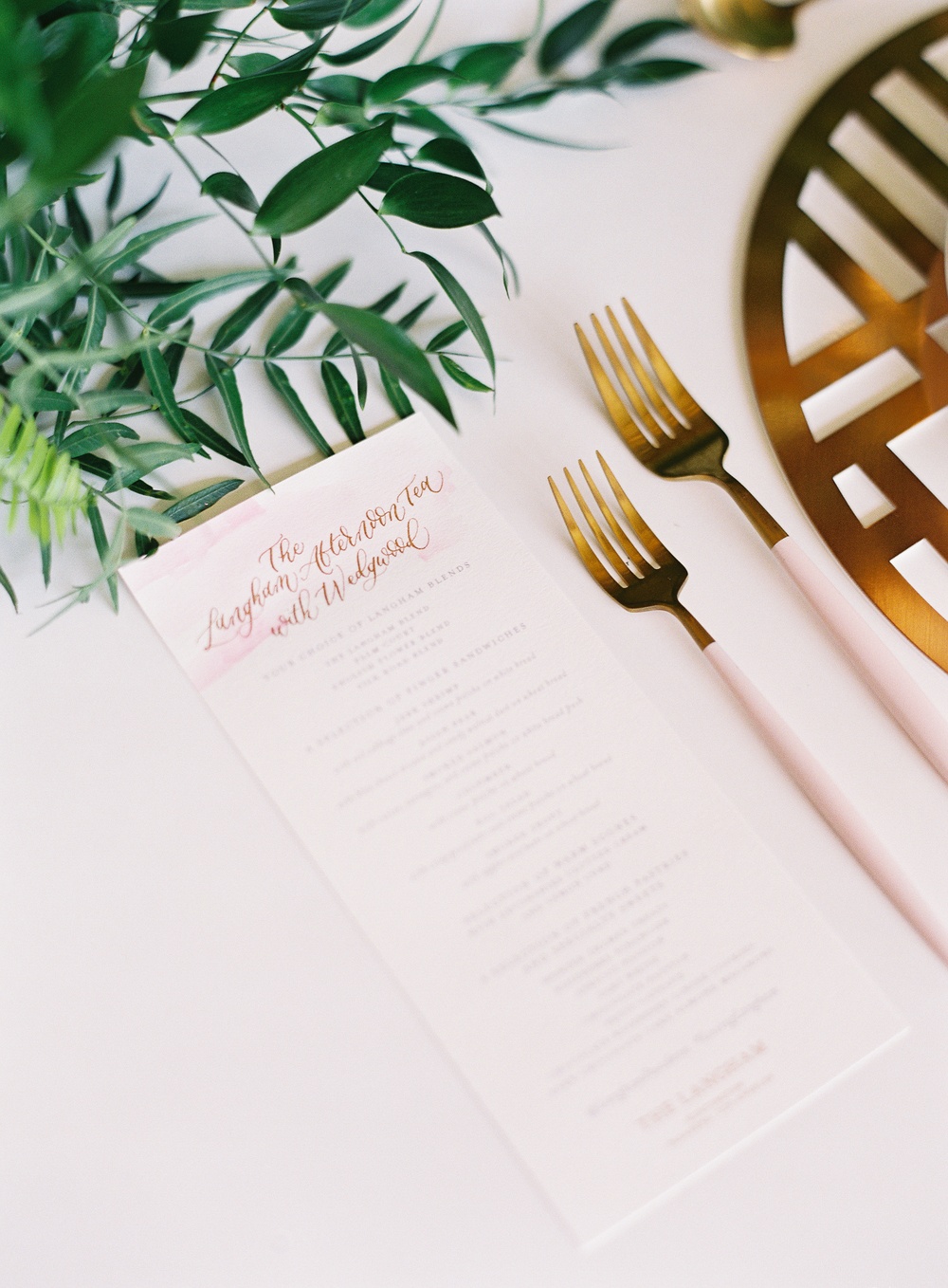 contemporary pink utensils and calligraphed menu