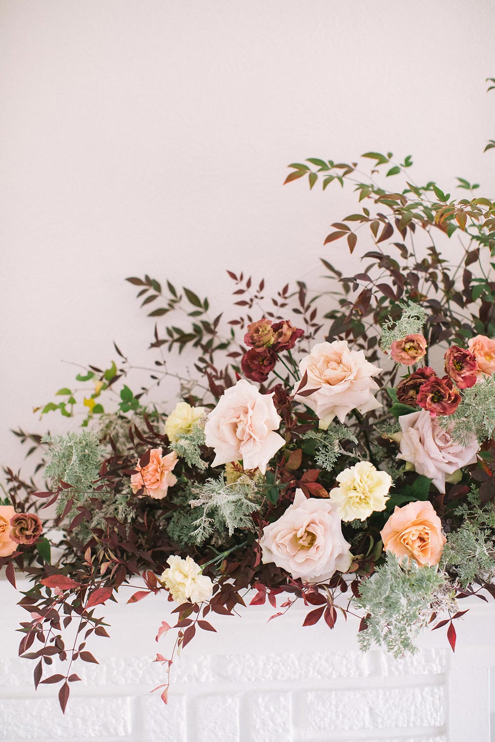 wild asymmetrical floral arrangement fine art wedding