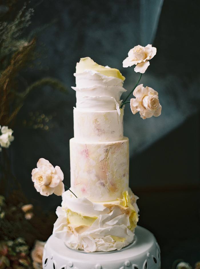 textured wedding cake with ruffled icing