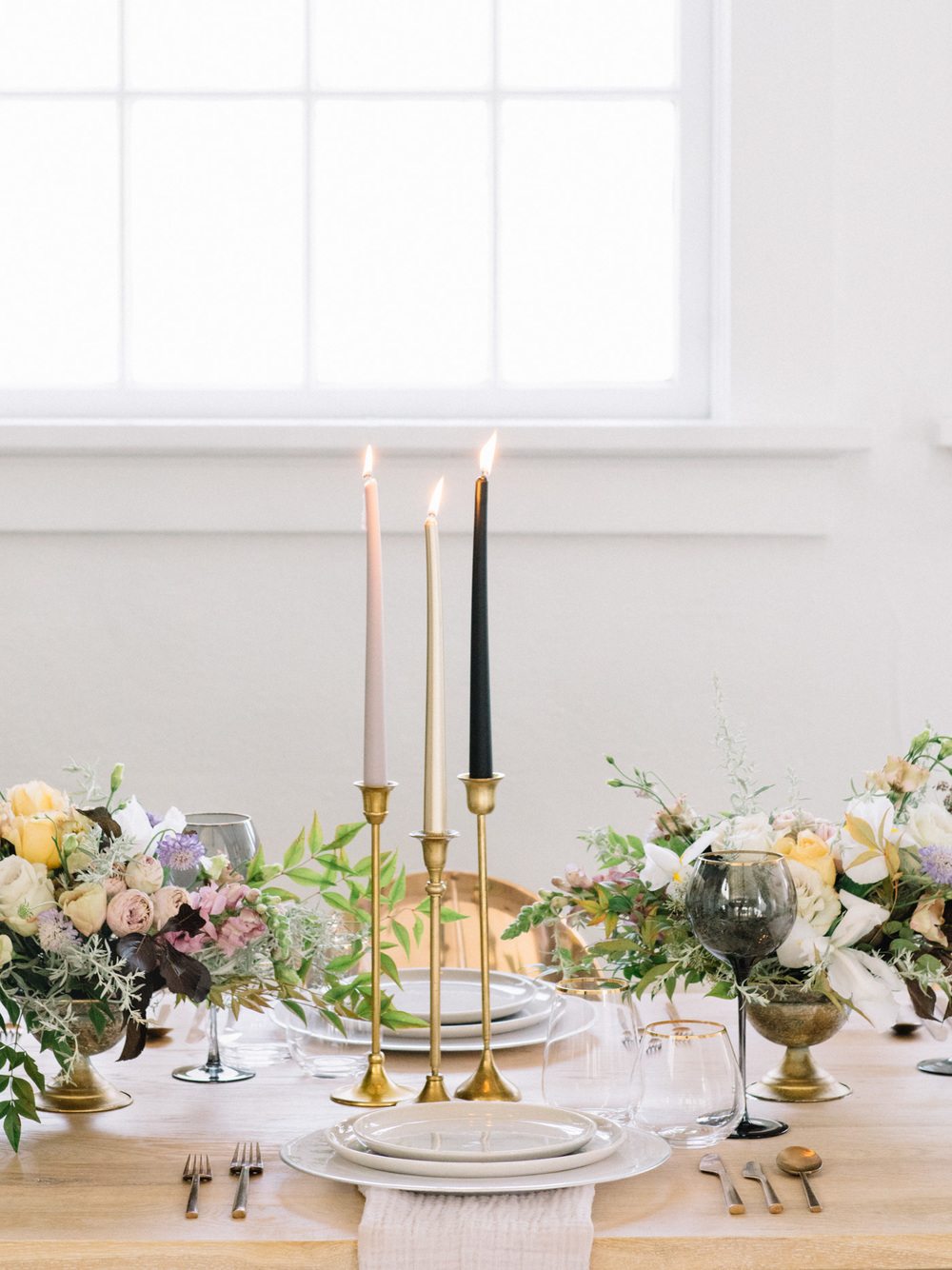 modern wedding place setting with candlestick trio