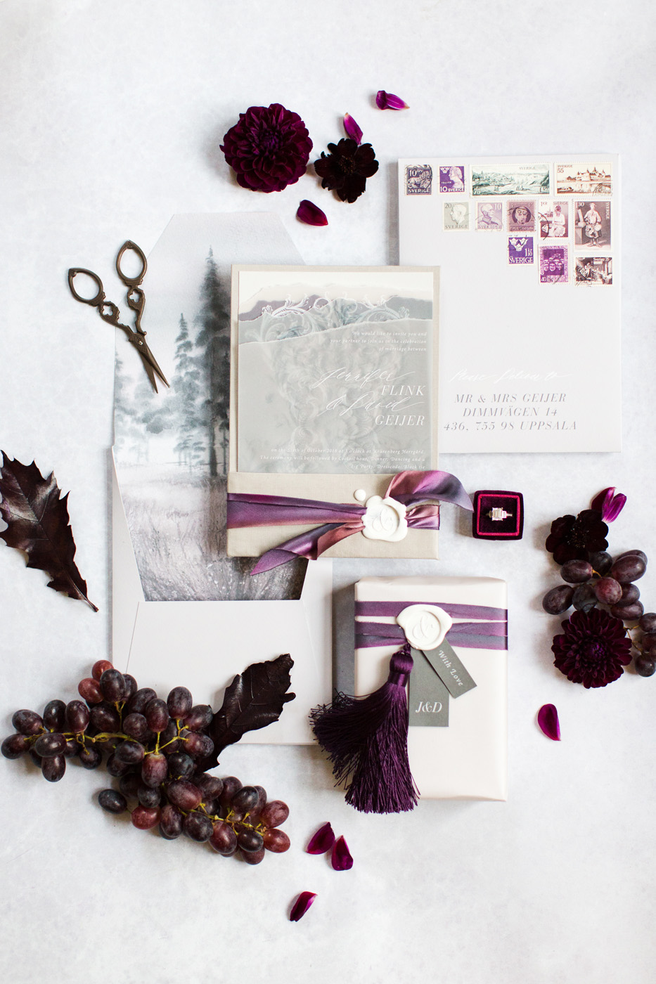 elegant plum invitation suite with white wax seals and tassels