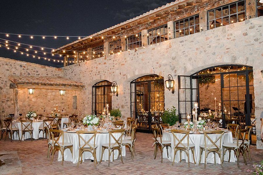 mediterranean wedding venue reception with string lights